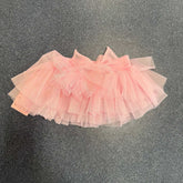 Child wearing Wear Moi Nuage tutu ballet skirt with glittering tulle and bow