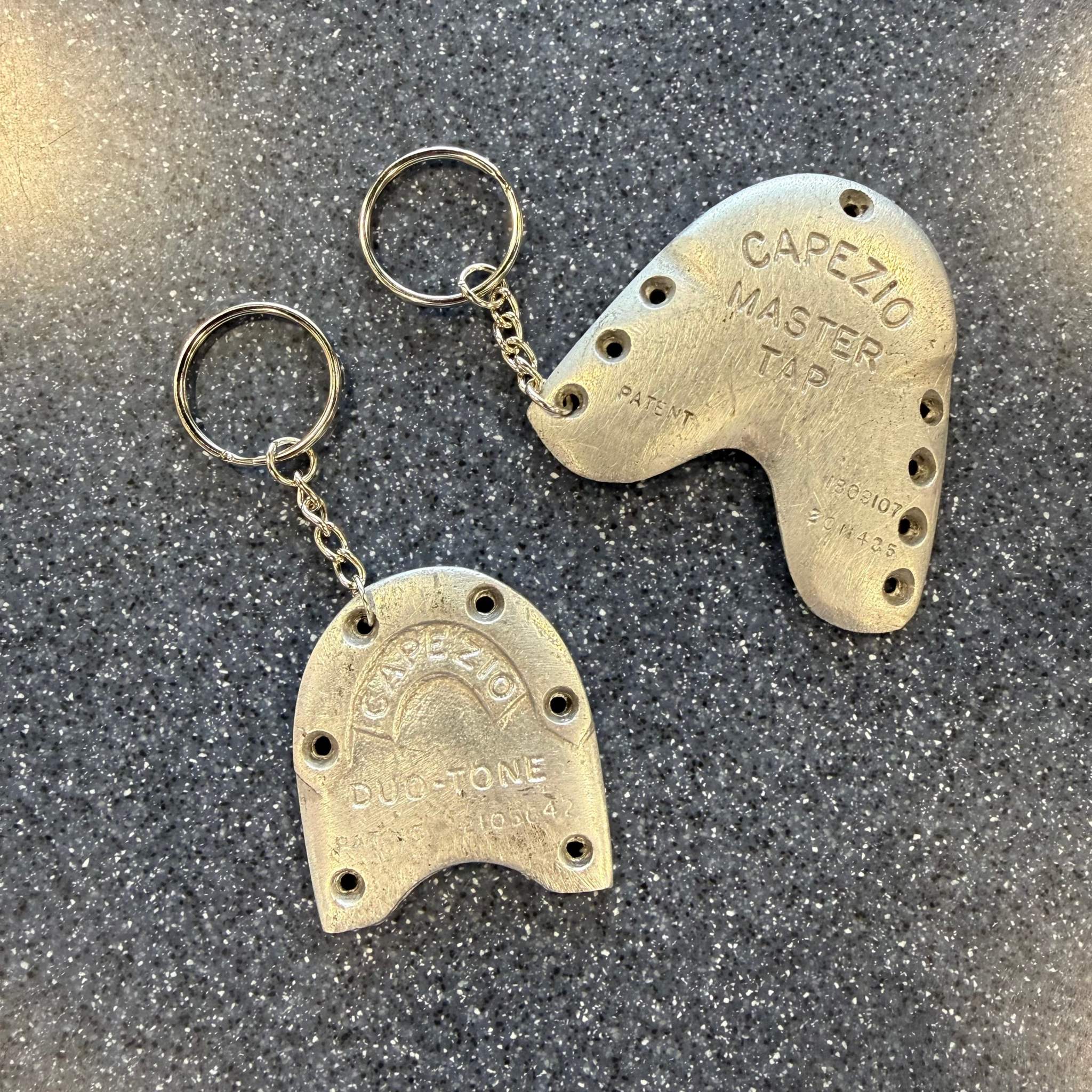 Tap shoe keychains made from a used metal tap