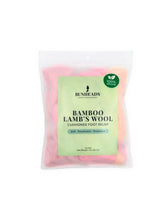 Capezio Bunheads Bamboo Lamb’s Wool in a translucent resealable bag with pastel pink and orange soft padding for foot relief