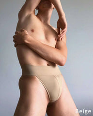 Dance Jox Thong dance belt in beige stretch fabric, with a wide waistband and padded front panel
