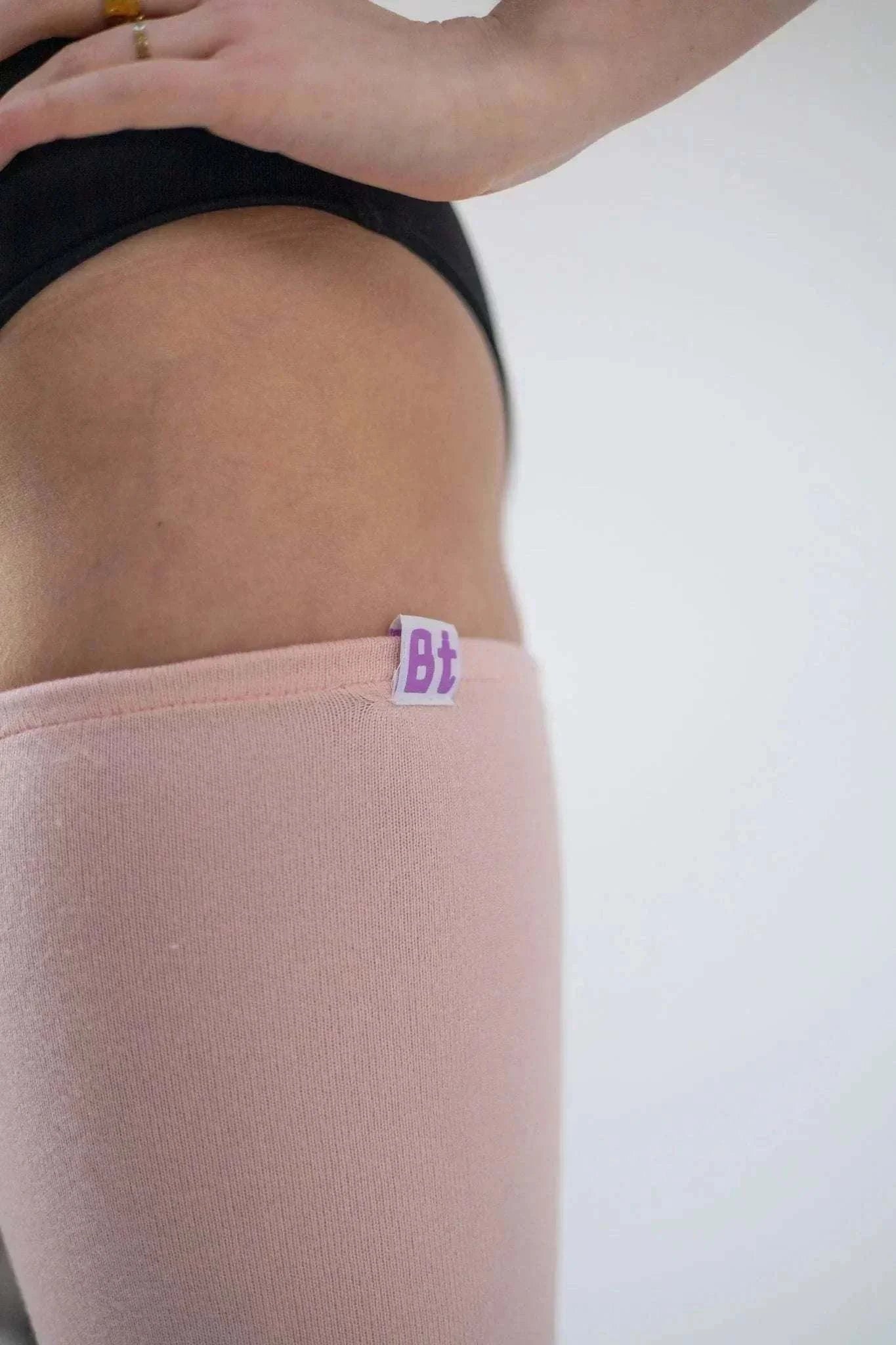 Barre Trash thigh-high leg warmers in neutral tones with scrunched styling