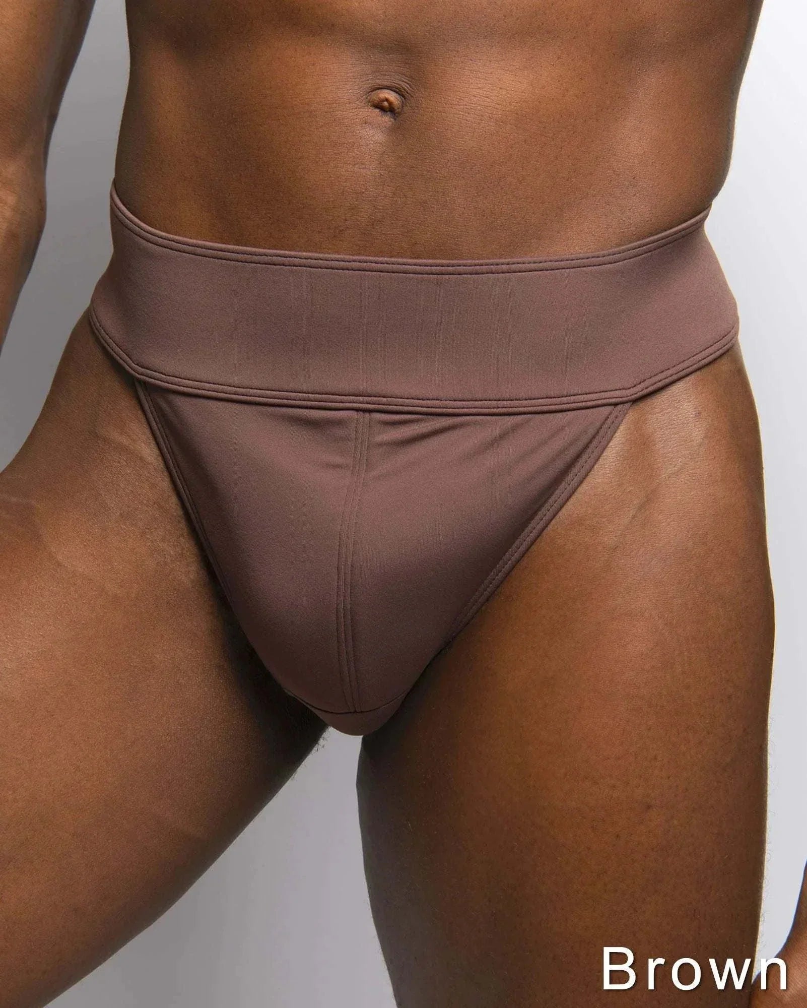 Dance Jox Thong dance belt in brown stretch fabric with a wide waistband and padded front panel