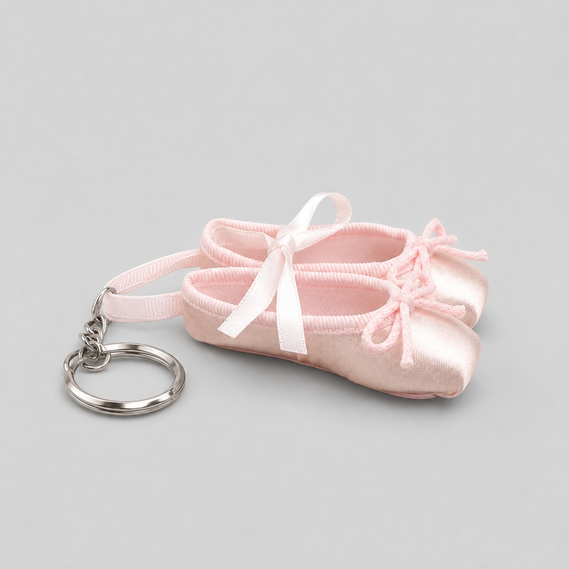 Fresh ballet pointe shoe keychain in soft pink satin with ribbon bow and lace-up details attached to metal ring